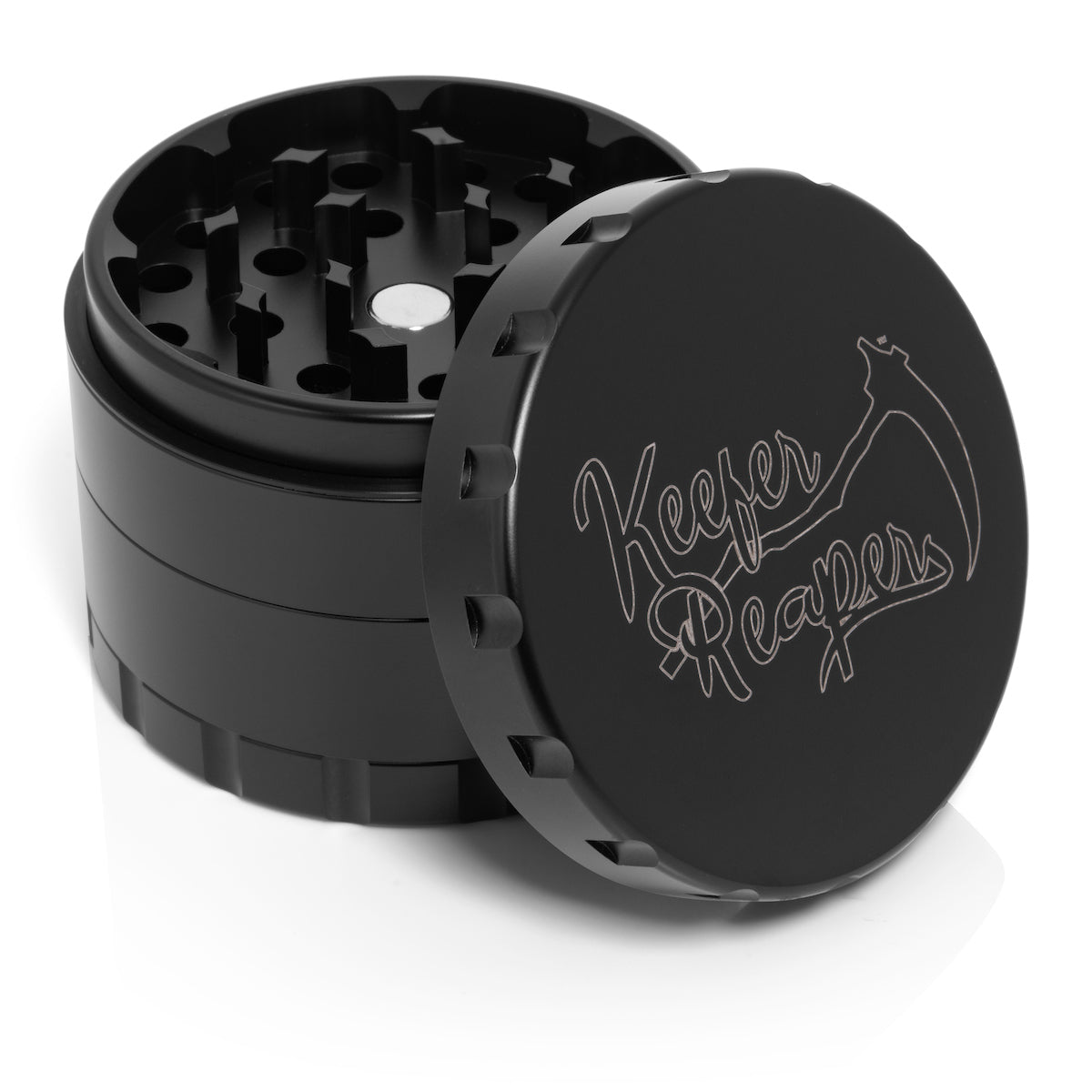 Black Stainless Steel Grinder with the lid detached and resting on the grinder. Keefer Reaper logo visible on the lid.